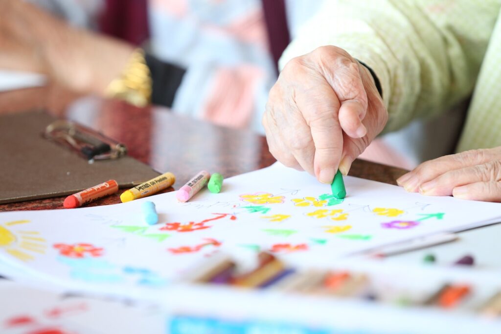 elderly using a coloring book