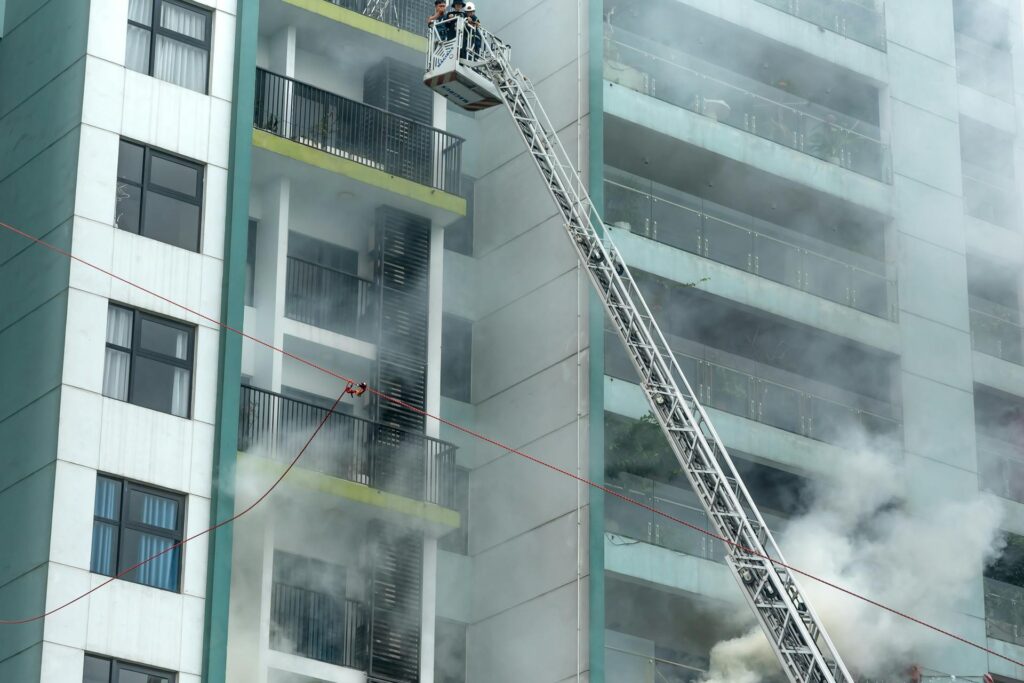 firefighters extinguishing fire from building